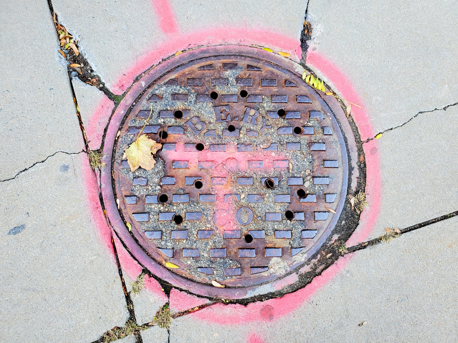 A Boston Elevated Railway manhole cover still in the street, 2020