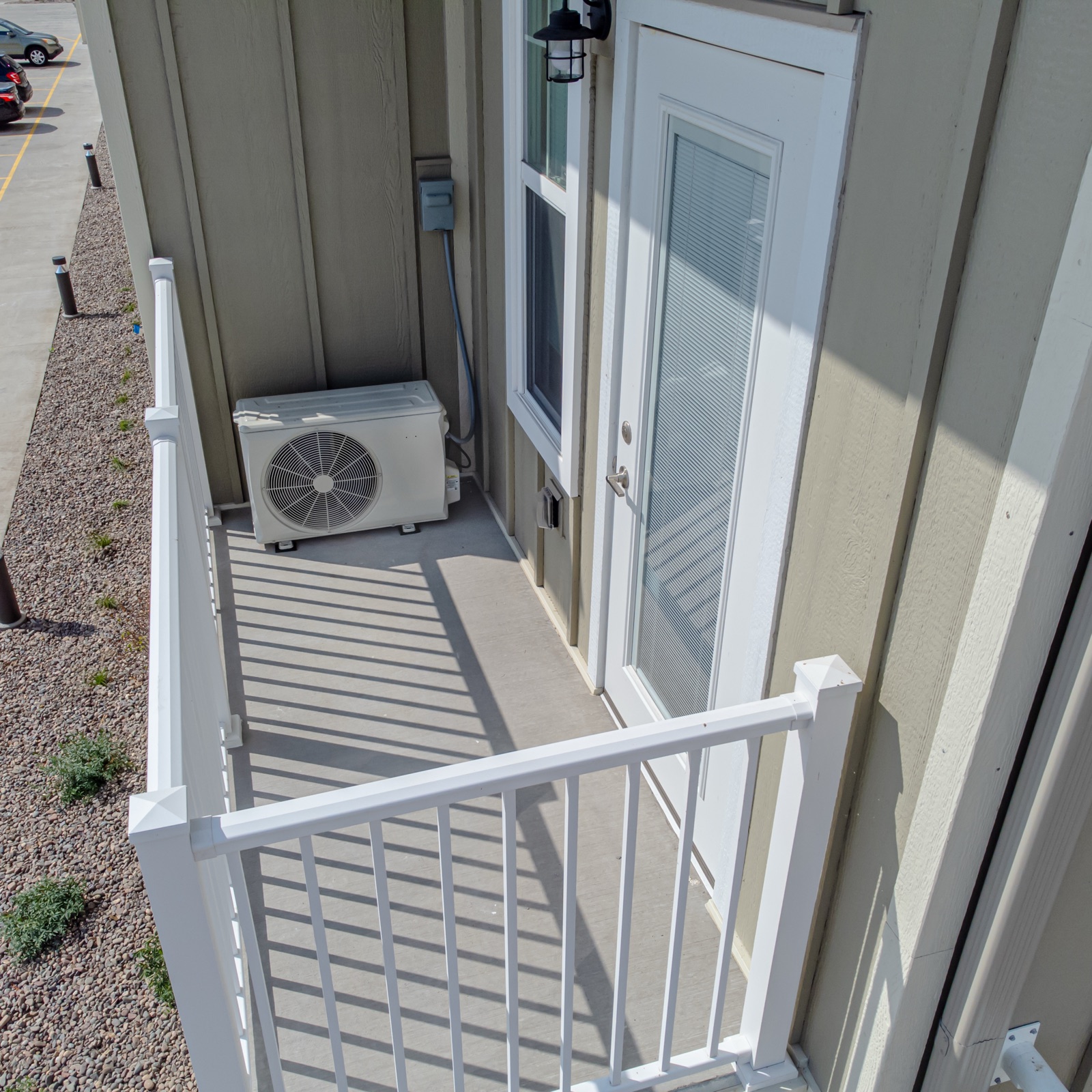Outdoor unit of a mini-split heat pump on a balcony